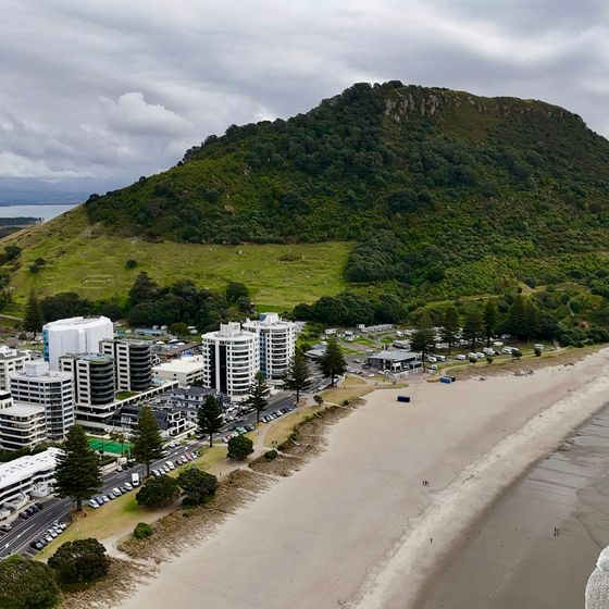 Aerial view of Mount Maunganui with its buildings, coastline and the ocean in Tauranga